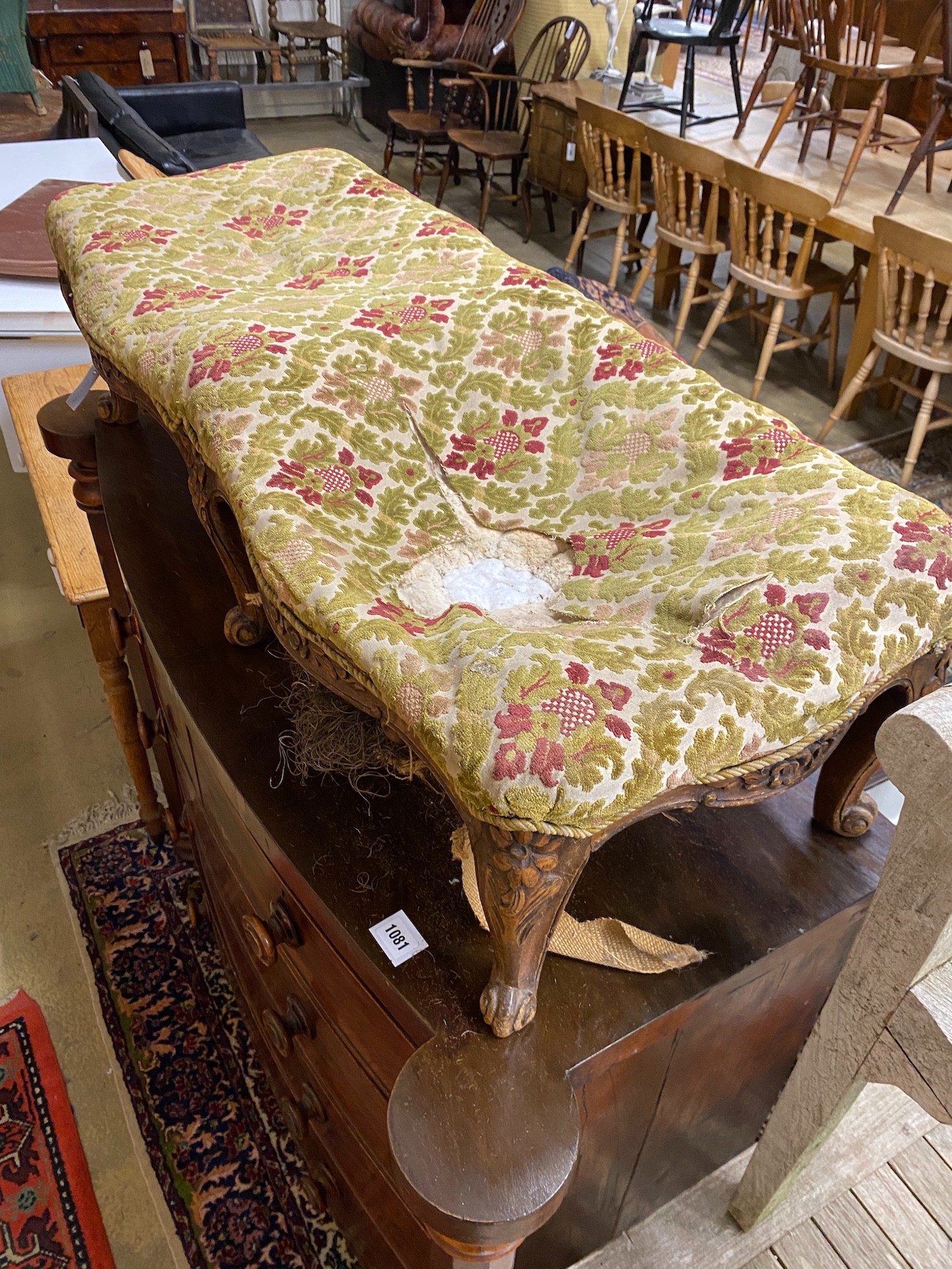 A 19th century French carved beech serpentine footstool, length 108cm